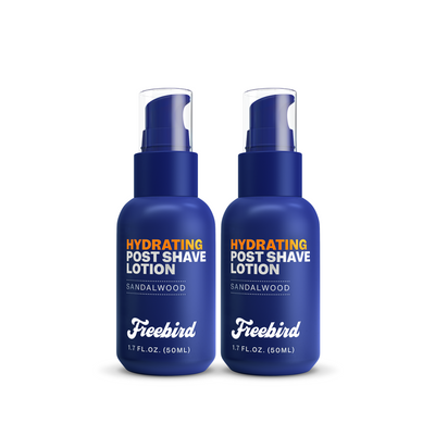 Two 1.7 fl oz blue bottles of Freebird Hydrating Post-Shave Lotion with sandalwood, a moisturizer perfect for reducing dryness.