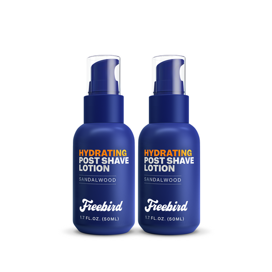 Two 1.7 fl oz blue bottles of Freebird Hydrating Post-Shave Lotion with sandalwood, a moisturizer perfect for reducing dryness.