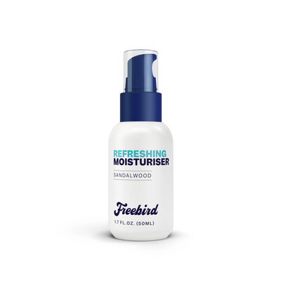 White bottle of Freebird Refreshing Scalp Moisturizer with a blue pump, labeled Sandalwood.