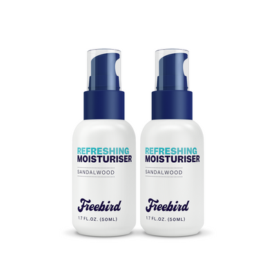 Two 50ml white bottles of Freebird Refreshing Scalp Moisturizer with blue caps for hydration and anti-aging.