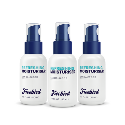 Three Freebird Refreshing Scalp Moisturizers with blue caps and white labels to enhance skin moisture.