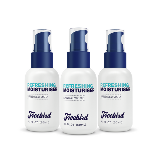 Three Freebird Refreshing Scalp Moisturizers with blue caps and white labels to enhance skin moisture.
