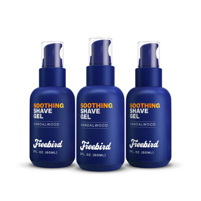 Three bottles of Freebirds Soothing Shave Gel, sandalwood-scented and blue, on a white background.